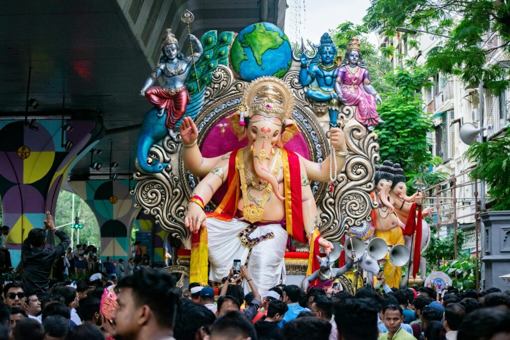 Large statue of Lord Ganesha paraded during Ganesh Chaturthi in Mumbai, India.